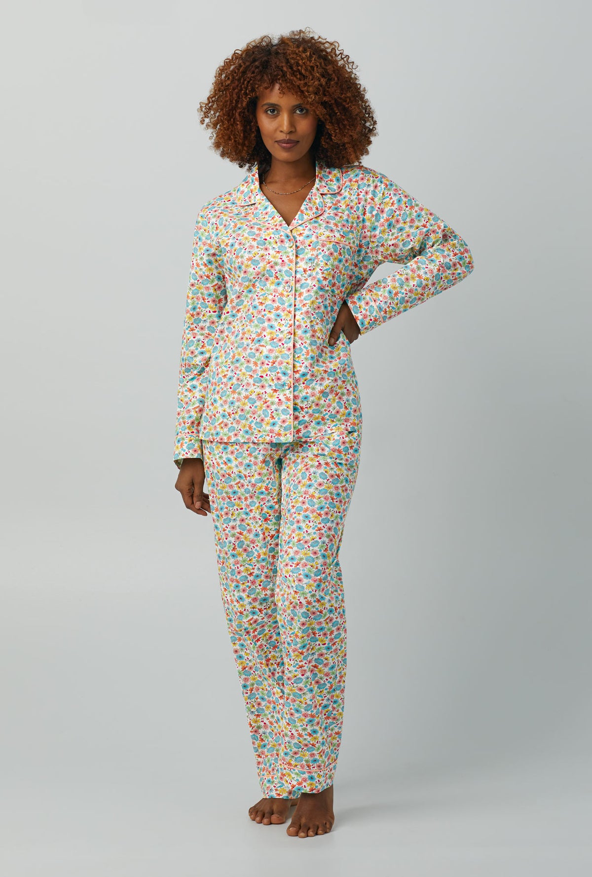 A lady wearing Long Sleeve Classic Woven Cotton Poplin PJ Set with spring time floral print