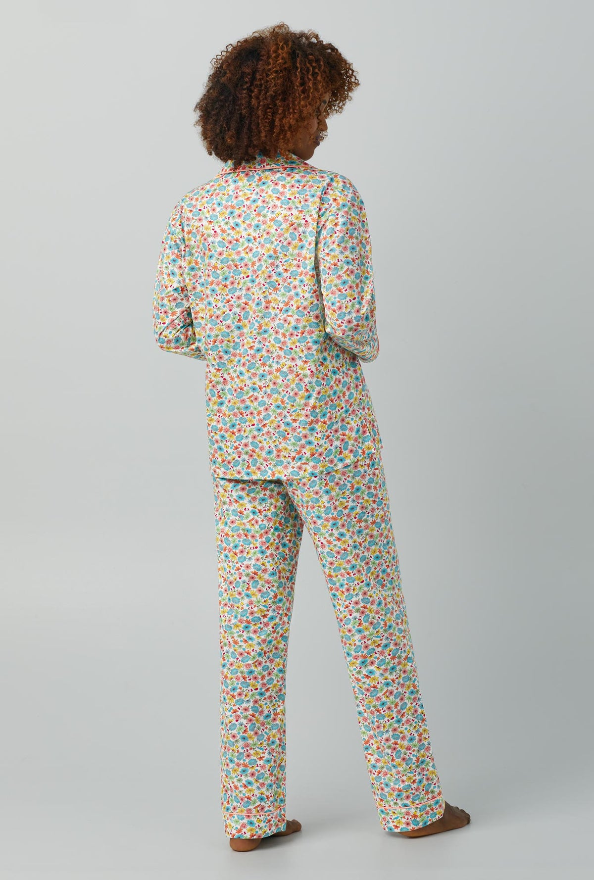 A lady wearing Long Sleeve Classic Woven Cotton Poplin PJ Set with spring time floral print