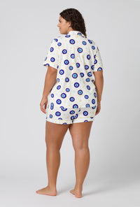A Lady Wearing Plus Size Eyeconic Short Sleeve Classic Shorty Stretch Jersey Pj Set in a back view pose