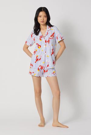 A lady wearing Coastal Feast Short Sleeve Classic Shorty Stretch Jersey Pj Set