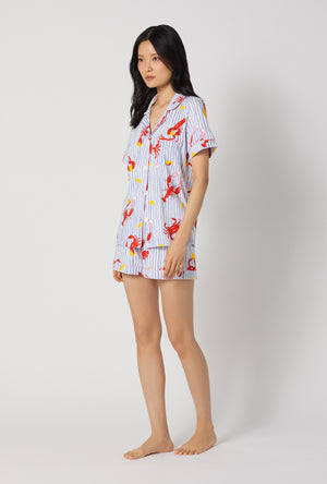 A lady wearing Coastal Feast Short Sleeve Classic Shorty Stretch Jersey Pj Set looking front
