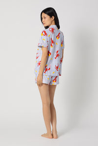 A lady wearing Coastal Feast Short Sleeve Classic Shorty Stretch Jersey Pj Set back view