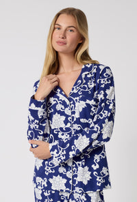 A Lady Wearing Dynasty Blue Long Sleeve Classic Stretch Jersey Pj Set in a close up shot
