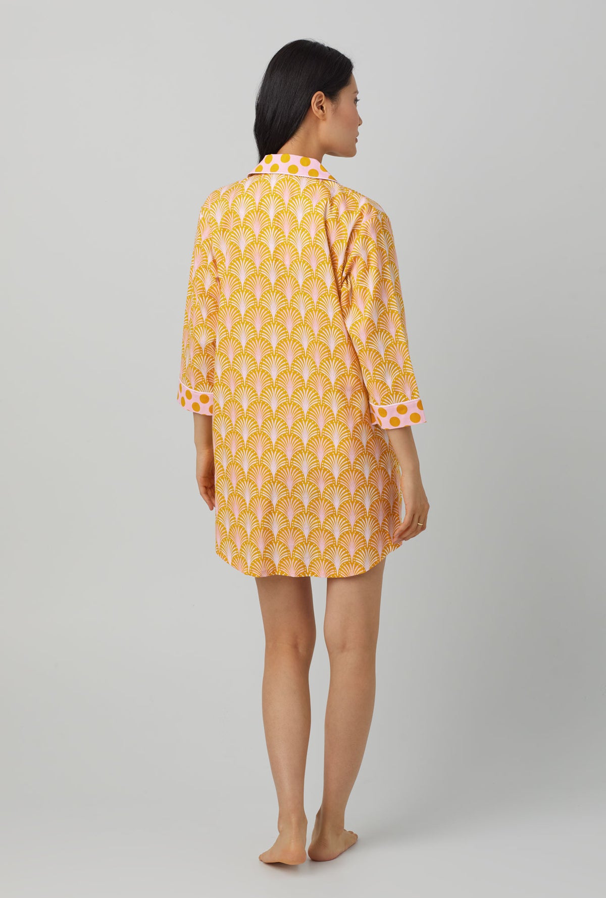 A lady wearing 3/4 sleeve classic woven cotton poplin sleepshirt with suite life print