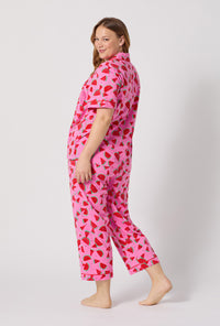 A lady wearing plus size Watermelon Crush Short Sleeve Classic Stretch Jersey Cropped Pj Set back view