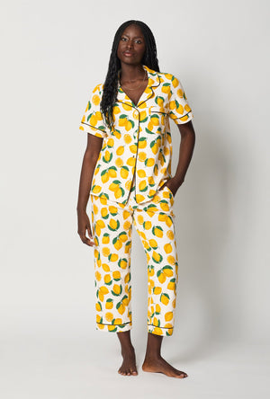 A lady one hand in pocket wearing White and Yellow Short Sleeve Classic Stretch Jersey Cropped Pj Set front view
