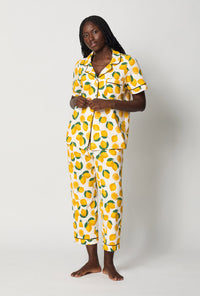 A lady wearing White and Yellow Short Sleeve Classic Stretch Jersey Cropped Pj Set side view
