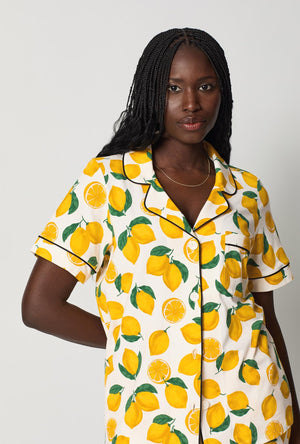 A closeup of A lady wearing White and Yellow Short Sleeve Classic Stretch Jersey Cropped Pj Set