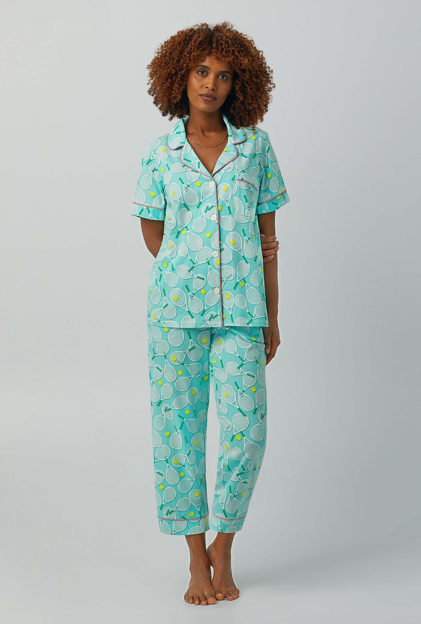 A lady wearing green Short Sleeve Classic Stretch Jersey Cropped PJ Set with Tennis Club print
