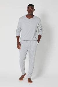 A man wearing True Grey Heather Men's Long Sleeve Henley And Jogger Cotton Rib Pj Set