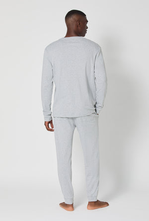 A man wearing True Grey Heather Men's Long Sleeve Henley And Jogger Cotton Rib Pj Set