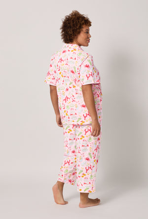 A lady wearing plus size French Quarter Short Sleeve Classic Stretch Jersey Cropped Pj Set