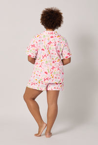 A lady wearing plus size French Quarter Short Sleeve Classic Shorty Stretch Jersey Pj Set