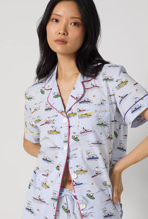 A lady wearing Catch A Wave, Snoopy Short Sleeve Classic Woven Cotton Poplin Shorty Pj Set closer look
