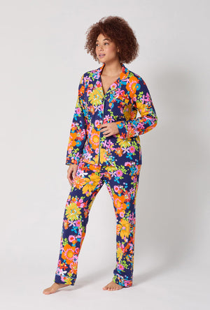 A lady wearing BedHead x Trina Turk Bay Street Bloom Long Sleeve Classic Stretch Jersey Pj Set