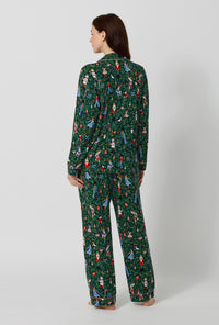 A lady wearing Rifle Paper Co. x BedHead PJs Nutcracker Long Sleeve Classic Stretch Jersey Pj Set back view