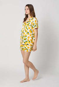 A lady wearing White and Yellow Short Sleeve Classic Shorty Stretch Jersey Pj Set side view