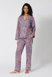 A Lady Wearing Dana Sharmin Long Sleeve Classic Woven Tana Lawn® Pj Set Made With Liberty Fabrics in a front faced standing pose