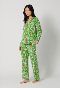 A Lady Wearing Monstera Bloom Long Sleeve Classic Stretch Jersey Pj Set facing front in a side angle pose