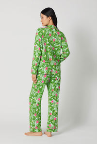 A Lady Wearing Monstera Bloom Long Sleeve Classic Stretch Jersey Pj Set turned back while showing the back view