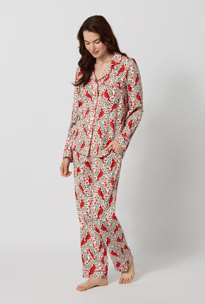 A lady wearing Rifle Paper Co. x BedHead PJs Cardinals Long Sleeve Classic Stretch Jersey Pj Set looking down