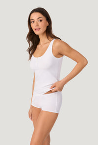 A lady wearing White Stretch Jersey Tank side view