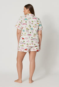 A lady wearing plus size Festive Flamingos Short Sleeve Classic Shorty Stretch Jersey Pj Set back view