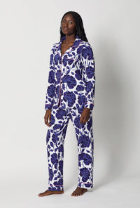 A lady wearing Blue and White Long Sleeve Classic Stretch Jersey Pj Set side view
