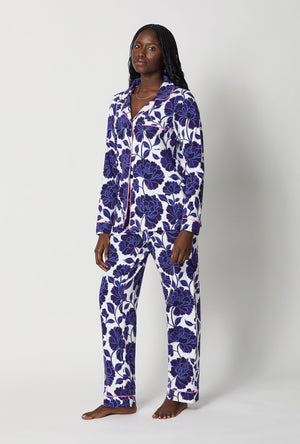 A lady wearing Blue and White Long Sleeve Classic Stretch Jersey Pj Set side view
