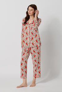 A lady wearing Rifle Paper Co. x BedHead PJs Cardinals 3/4 Sleeve Classic Stretch Jersey Cropped Pj Set looking side