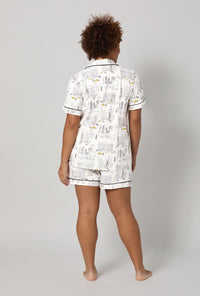 A lady wearing plus City That Never Sleeps Short Sleeve Classic Shorty Stretch Jersey PJ Set