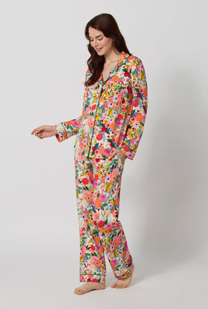 A lady wearing Rifle Paper Co. x BedHead PJs Garden Party Long Sleeve Classic Stretch Jersey Pj Set looking down