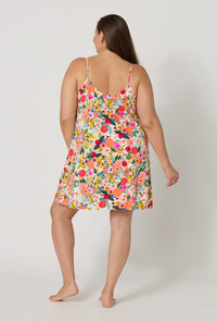 A lady wearing plus size Rifle Paper Co. x BedHead PJs Garden Party Stretch Jersey Chemise back view
