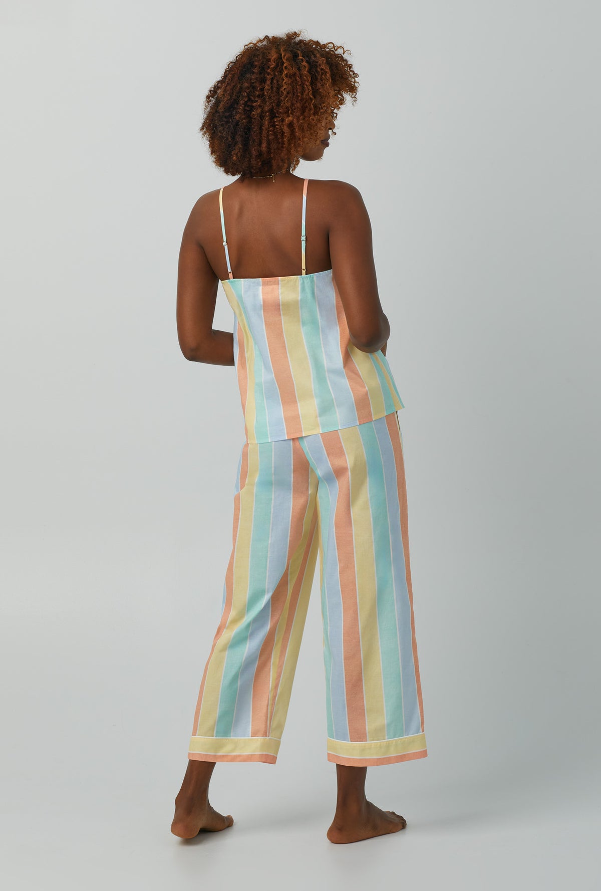 A lady wearing multi color Tank Woven Cotton Poplin Cropped PJ Set with Sunset Stripe print