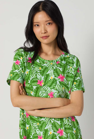 A Lady Wearing Monstera Bloom Stretch Jersey T-shirt Sleep Dress posing in a close up view look