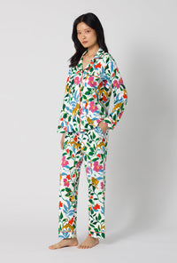 A Lady Wearing Jungle Serenade Long Sleeve Classic Stretch Jersey Pj Set facing front in a side angle view