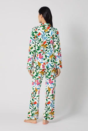 A Lady Wearing Jungle Serenade Long Sleeve Classic Stretch Jersey Pj Set turned back in a full standing pose