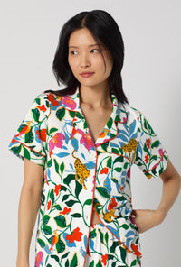 A Lady Wearing Jungle Serenade Short Sleeve Classic Stretch Jersey Cropped Pj Set posing in a half zoomed close up shot