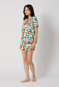 A Lady Wearing Jungle Serenade Short Sleeve Classic Shorty Stretch Jersey Pj Set posing in a side angle view