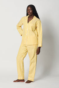 A lady wearing Yellow Long Sleeve Classic Woven Cotton Sateen Pj Set side view