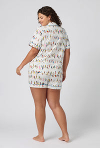 A lady wearing plus size Run NYC Run Short Sleeve Classic Shorty Stretch Jersey Pj Set back view
