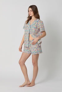 A lady wearing Multi-Color and Pink Short Sleeve Classic Woven Cotton Poplin Shorty Pj Set side view