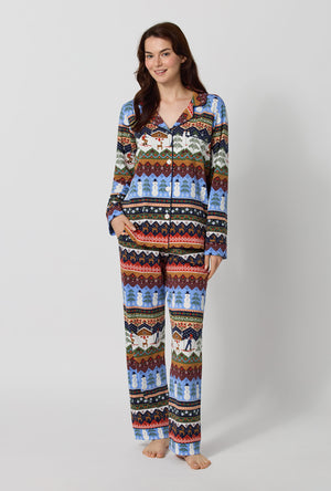 A lady wearing Rifle Paper Co. x BedHead PJs Ski Chalet Long Sleeve Classic Stretch Jersey Pj Set
