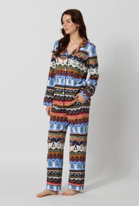 A lady wearing Rifle Paper Co. x BedHead PJs Ski Chalet Long Sleeve Classic Stretch Jersey Pj Set looking side