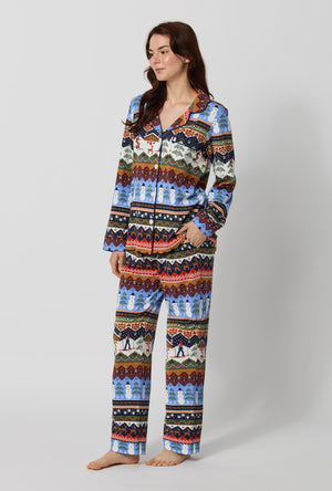 A lady wearing Rifle Paper Co. x BedHead PJs Ski Chalet Long Sleeve Classic Stretch Jersey Pj Set looking side