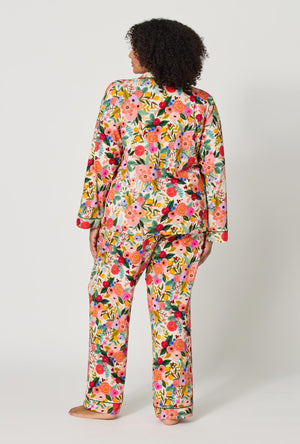 A lady wearing plus size Rifle Paper Co. x BedHead PJs Garden Party Long Sleeve Classic Stretch Jersey Pj Set back view