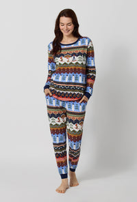 A lady wearing Rifle Paper Co. x BedHead PJs Ski Chalet Long Sleeve Pullover Crew And Jogger Stretch Jersey Pj Set looking down