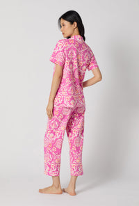 A Lady Wearing Luxe Leopard Short Sleeve Classic Stretch Jersey Cropped Pj Set posing with a back view