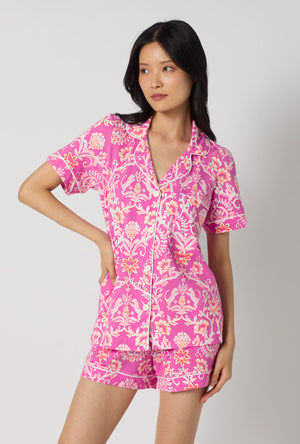 A Lady Wearing Luxe Leopard Short Sleeve Classic Shorty Stretch Jersey Pj Set facing front while looking to the side