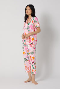 A Lady Wearing Tropical Daydream Short Sleeve Classic Stretch Jersey Cropped Pj Set posing in a side angle view